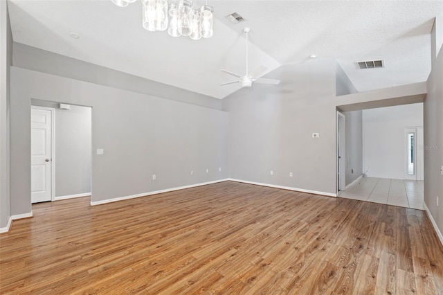 unfurnished living room with light hardwood / wood-style flooring, ceiling fan, and lofted ceiling