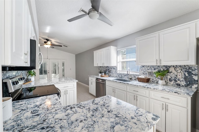 kitchen with sink, white cabinets, and appliances with stainless steel finishes