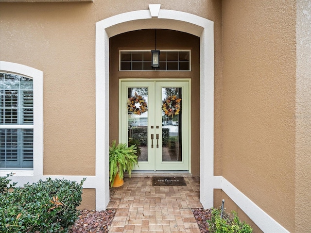 entrance to property featuring french doors