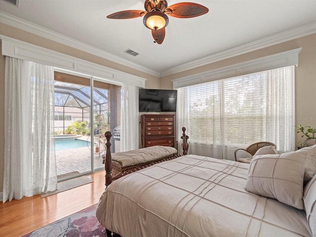 bedroom featuring access to exterior, hardwood / wood-style floors, ceiling fan, and ornamental molding