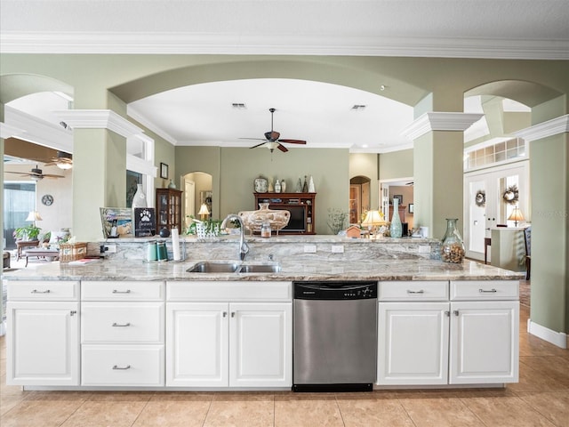 kitchen with french doors, light stone counters, sink, dishwasher, and white cabinetry