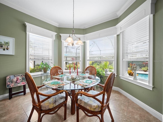 tiled dining space with a chandelier and crown molding