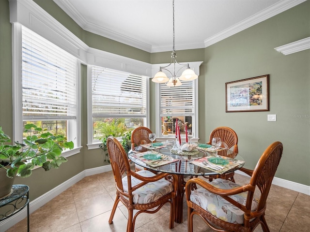 tiled dining room with a notable chandelier and ornamental molding