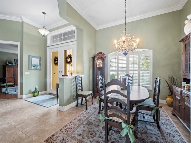 dining room featuring ornamental molding, light tile patterned floors, and a chandelier