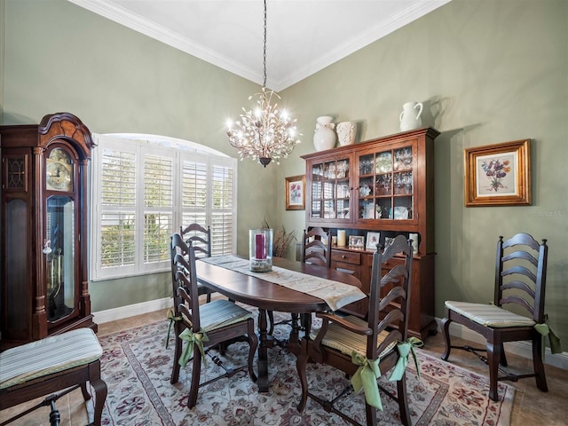 dining area with a chandelier and crown molding