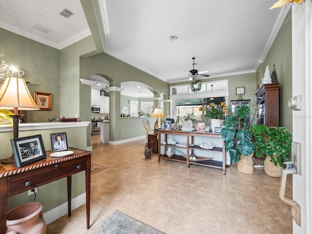 interior space featuring ceiling fan and crown molding