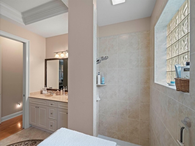 bathroom with tile patterned flooring, vanity, an enclosed shower, and ornamental molding