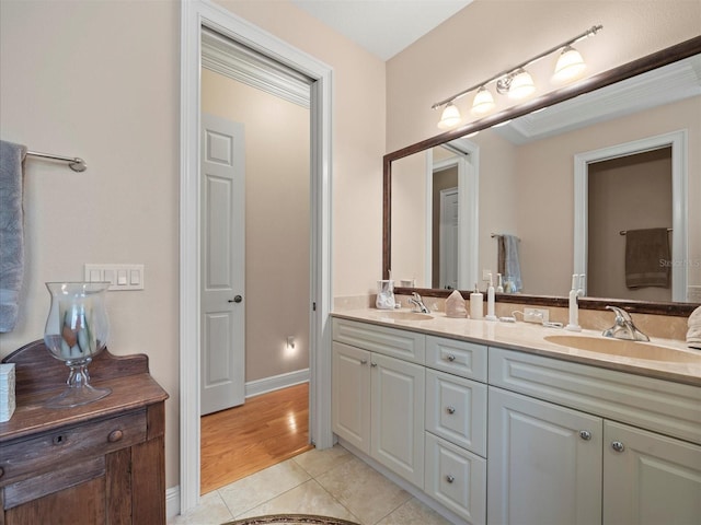 bathroom featuring tile patterned flooring and vanity