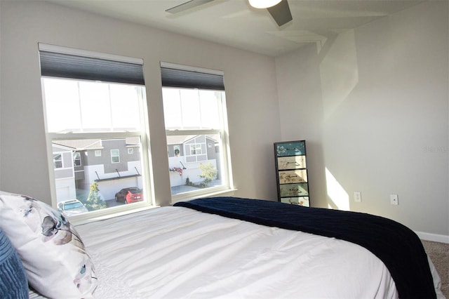 bedroom featuring ceiling fan and carpet floors