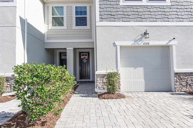 view of exterior entry featuring a garage