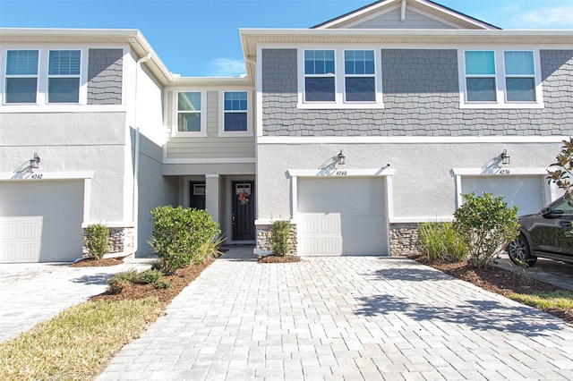 multi unit property featuring a garage