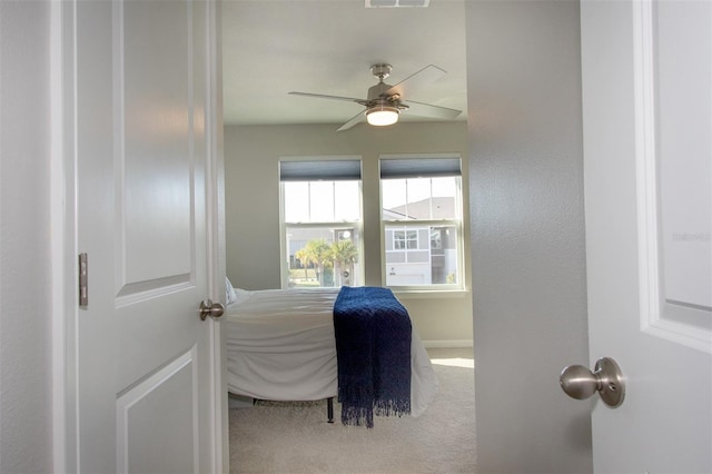 bedroom with ceiling fan and carpet floors