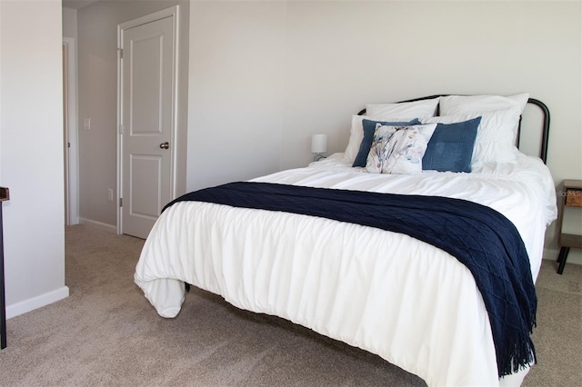 bedroom featuring light carpet