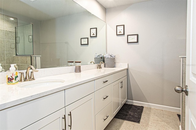 bathroom with vanity and a tile shower