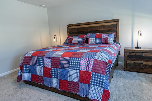 bedroom with light colored carpet