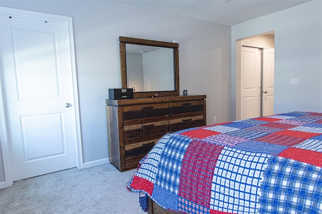 carpeted bedroom featuring a closet