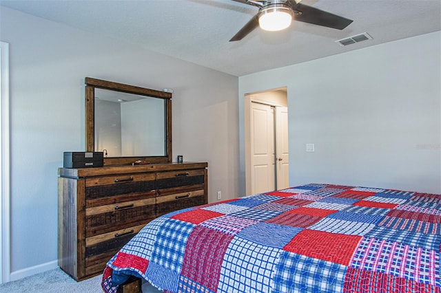 carpeted bedroom with ceiling fan