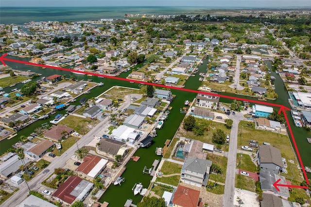 bird's eye view with a water view and a residential view