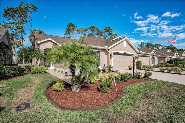 ranch-style home featuring a garage and a front lawn