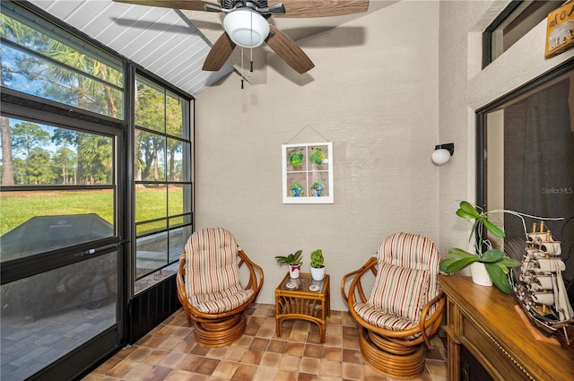 sunroom featuring ceiling fan and lofted ceiling