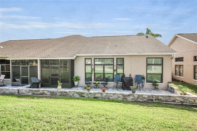 back of house featuring a yard and a patio area