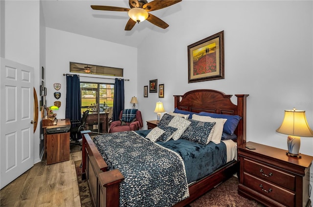 bedroom featuring vaulted ceiling, wood-type flooring, and ceiling fan