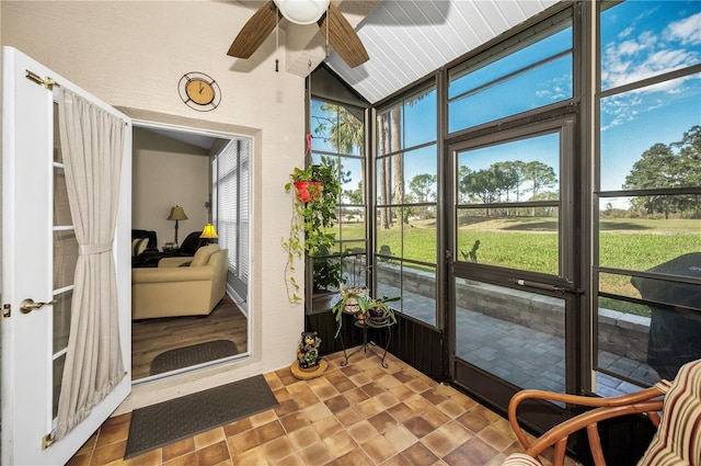 sunroom featuring ceiling fan