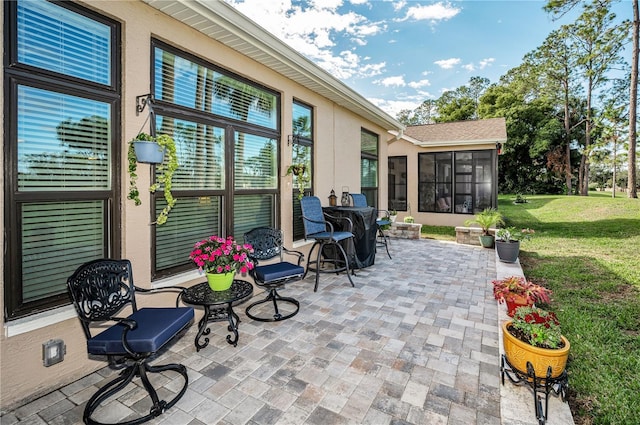 view of patio with a sunroom