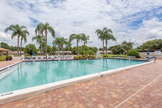 view of swimming pool with a patio