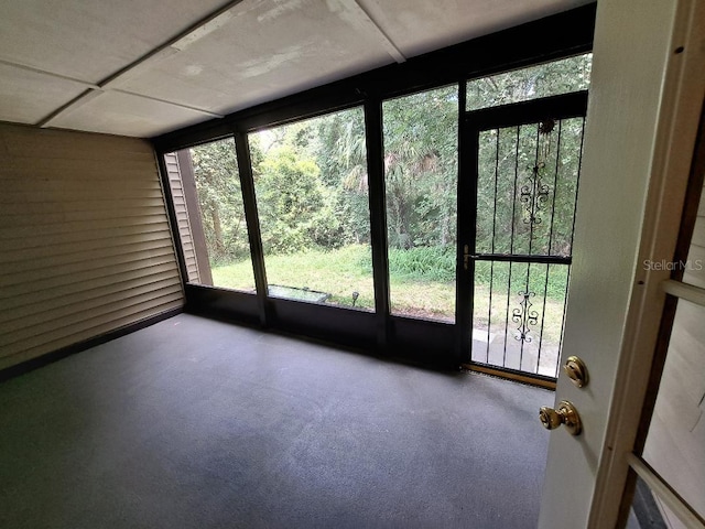 unfurnished sunroom featuring plenty of natural light