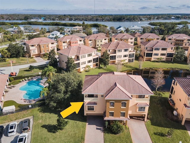 birds eye view of property with a water view