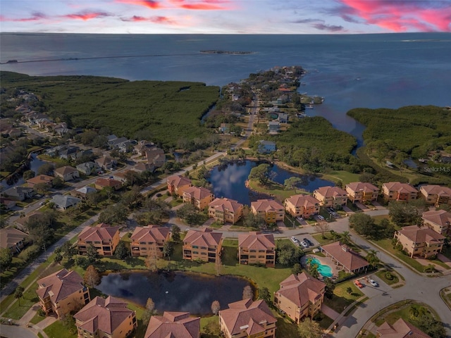 aerial view at dusk with a water view