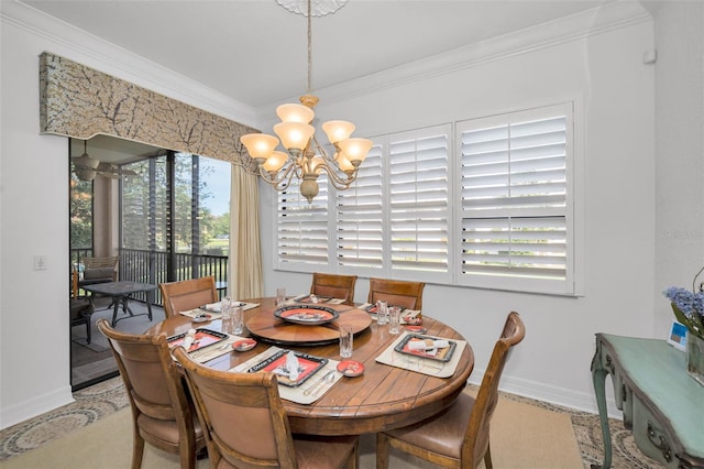 dining room with crown molding and a notable chandelier