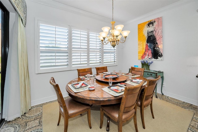 dining space featuring plenty of natural light, ornamental molding, and an inviting chandelier