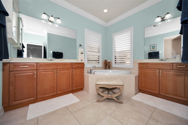 bathroom featuring tile patterned floors, a tub, vanity, and ornamental molding