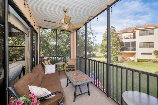 sunroom with ceiling fan and a healthy amount of sunlight