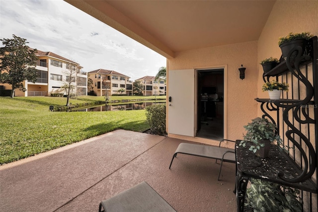 view of patio / terrace featuring a water view