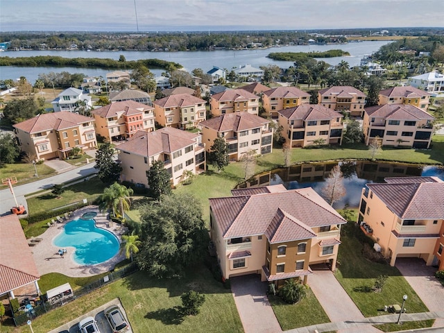 birds eye view of property featuring a water view