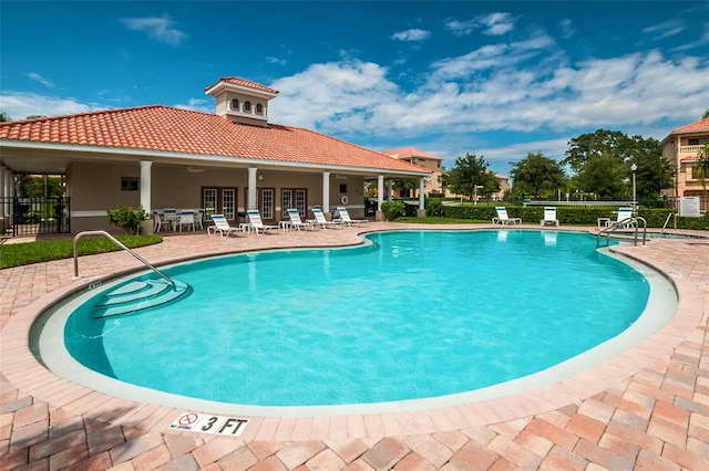 view of pool featuring a patio