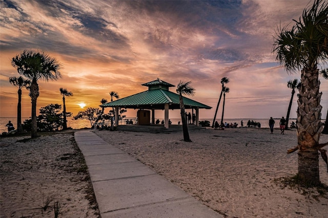 view of property's community with a gazebo and a water view