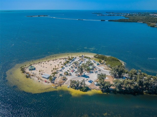 birds eye view of property with a beach view and a water view