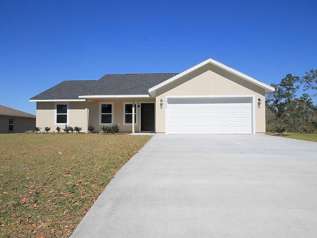 single story home featuring a garage and a front yard