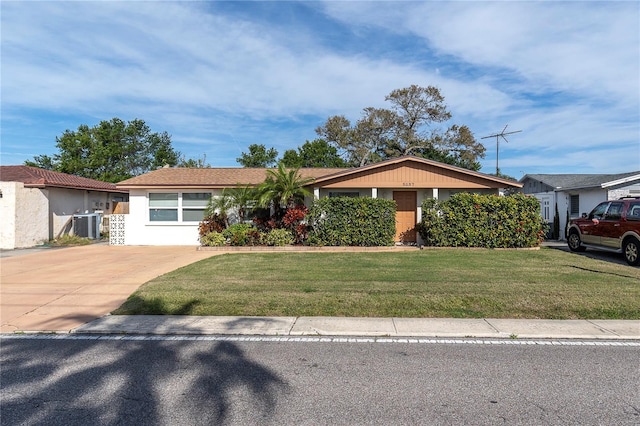 ranch-style home featuring central air condition unit and a front yard