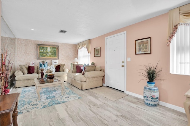 living room with light hardwood / wood-style floors