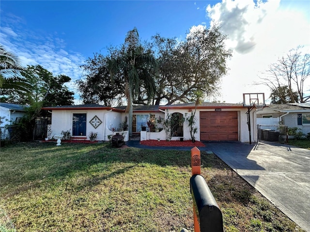 ranch-style home with a garage and a front lawn