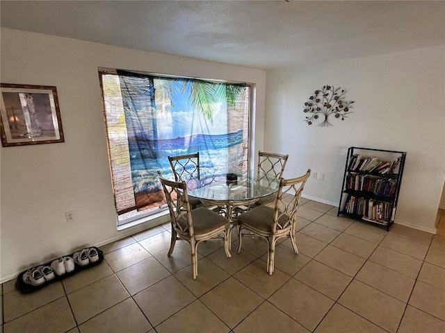 dining area featuring tile patterned floors