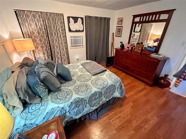 bedroom with hardwood / wood-style floors