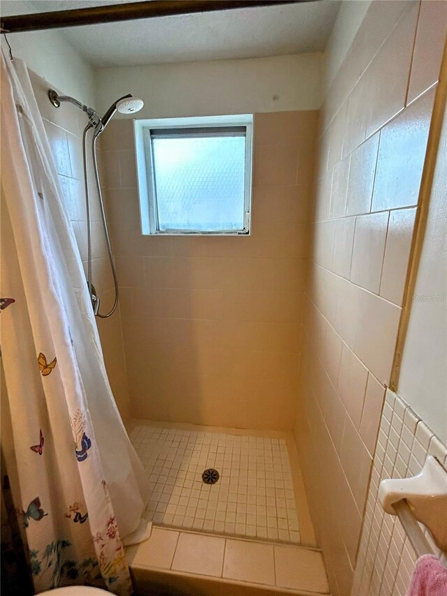 bathroom with a shower with curtain