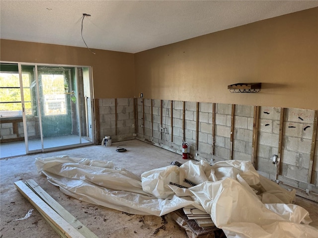 miscellaneous room with a textured ceiling