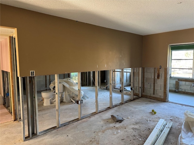 miscellaneous room with a textured ceiling